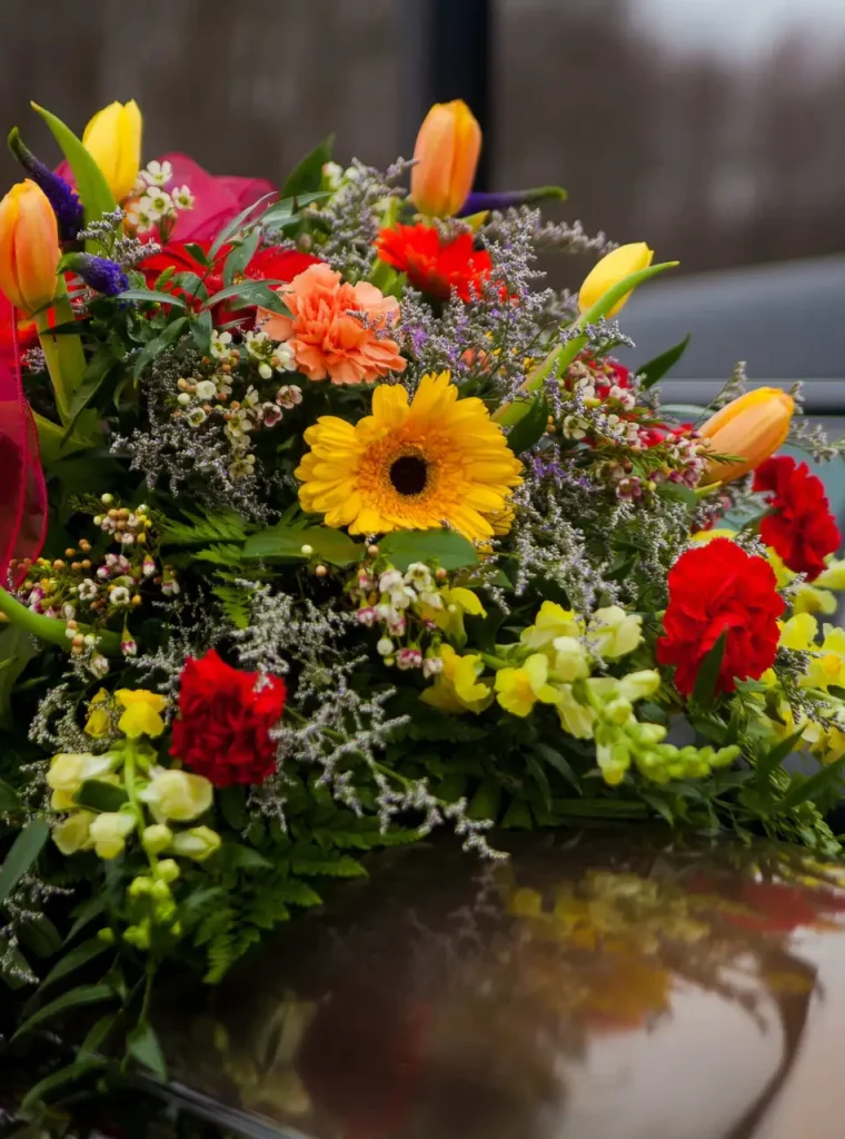 funeral-casket-and-flowers-next-to-hearse-2022-11-02-03-43-23-utc (1) (1)