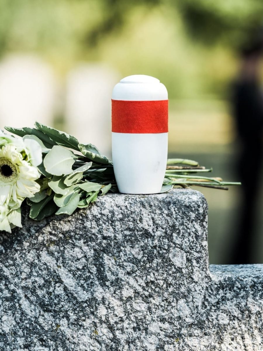 selective-focus-of-flowers-and-mortuary-urn-on-tom-2022-12-16-20-42-33-utc (1) (2) (1)